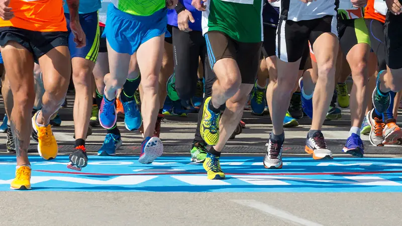 Legs of people running a marathon